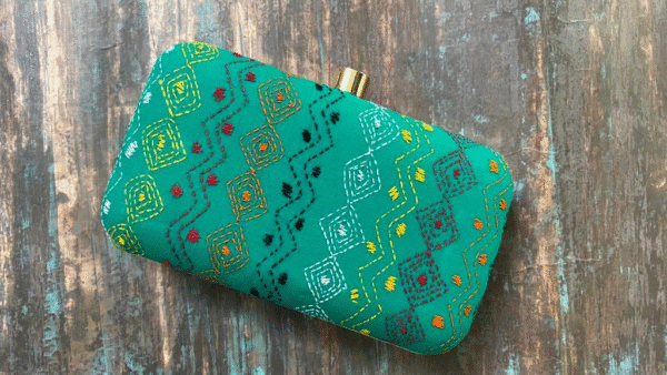 "Experience the Rich Cultural Heritage of India with Our Jade Green Kantha Clutch"
