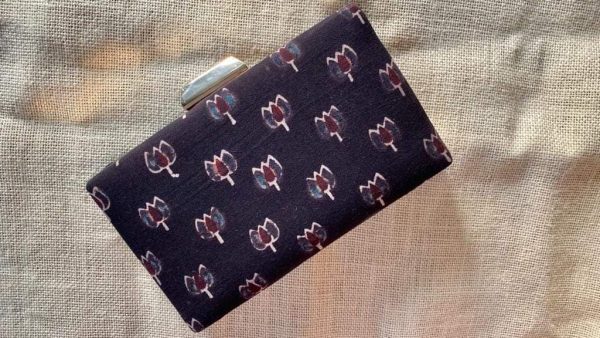 "Carry a Piece of Tradition Everywhere You Go with our Eggplant Purple Ajrakh Clutch"