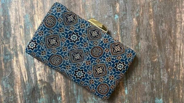"Carry a Piece of Tradition Everywhere You Go with our Adriatic Sea Ajrakh Clutch"