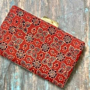 "Carry a Piece of Tradition Everywhere You Go with our Light Crimson Ajrakh Clutch"