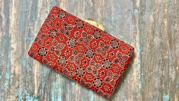 "Carry a Piece of Tradition Everywhere You Go with our Light Crimson Ajrakh Clutch"