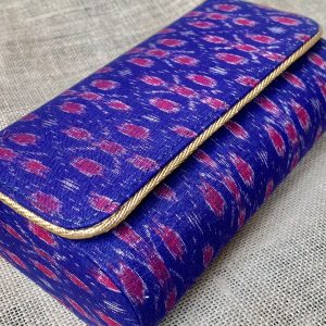 "Elevate Your Ensemble With The Artistry Of Persian Blue Sambalpuri Weaves, Embodied In Our Stunning Clutches."