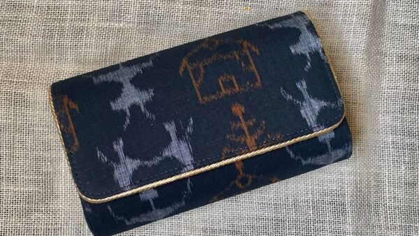 "Indulge in the allure of Dark Navy Blue Sambalpuri elegance, held in the palm of your hand." - Image 2
