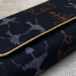 "Indulge in the allure of Dark Navy Blue Sambalpuri elegance, held in the palm of your hand."