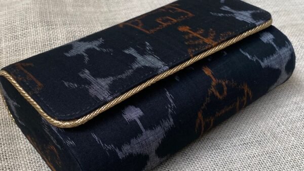 "Indulge in the allure of Dark Navy Blue Sambalpuri elegance, held in the palm of your hand."