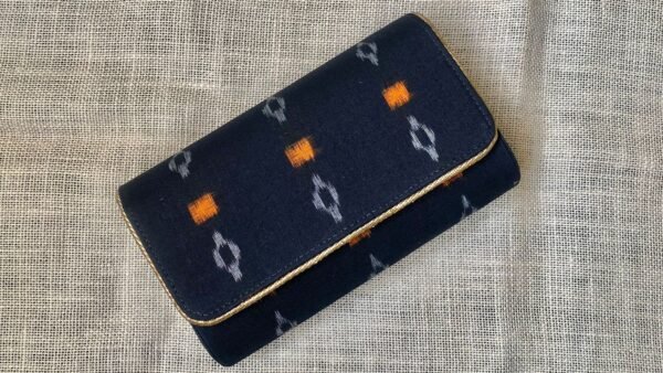 "Experience the fusion of tradition and style with our Dark Navy Blue Sambalpuri clutch masterpieces." - Image 2